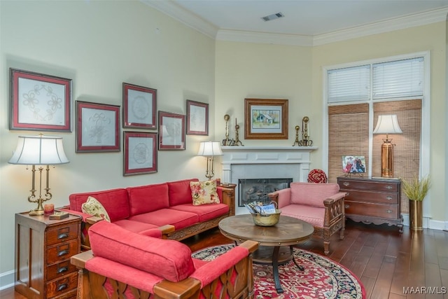 living room featuring dark wood-type flooring and ornamental molding