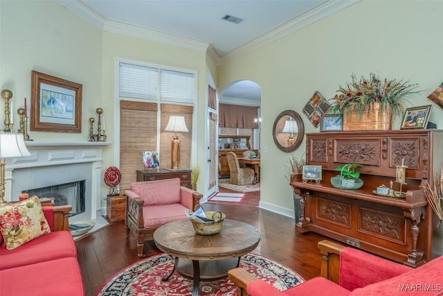 sitting room featuring crown molding and dark hardwood / wood-style floors