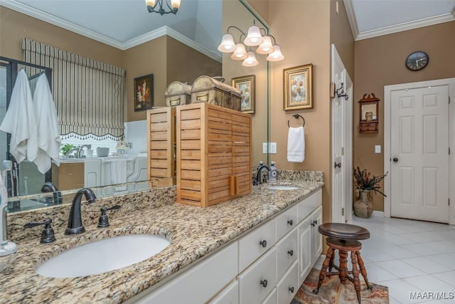 bathroom featuring ornamental molding, tile patterned floors, vanity, and a chandelier