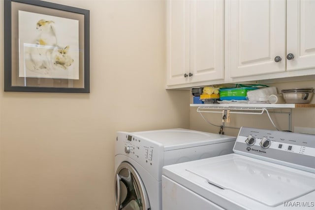 laundry area featuring cabinets and independent washer and dryer