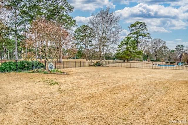 view of yard featuring a community pool