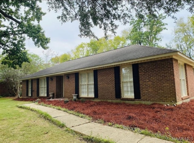 ranch-style house with a front lawn