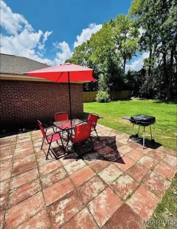 view of patio featuring fence
