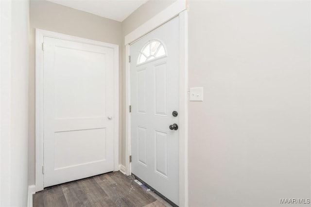 doorway with dark wood-type flooring