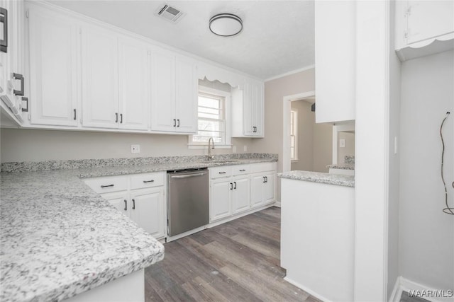 kitchen featuring wood-type flooring, white cabinets, stainless steel dishwasher, crown molding, and light stone countertops