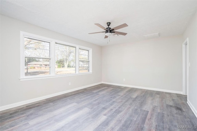 spare room featuring hardwood / wood-style flooring and ceiling fan