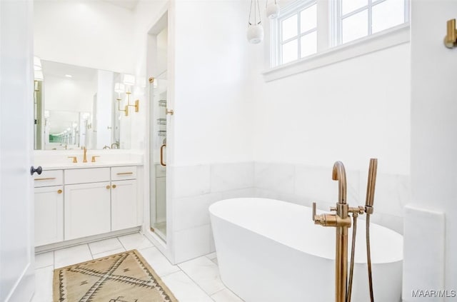 full bathroom featuring a soaking tub, a wainscoted wall, vanity, a shower stall, and tile walls