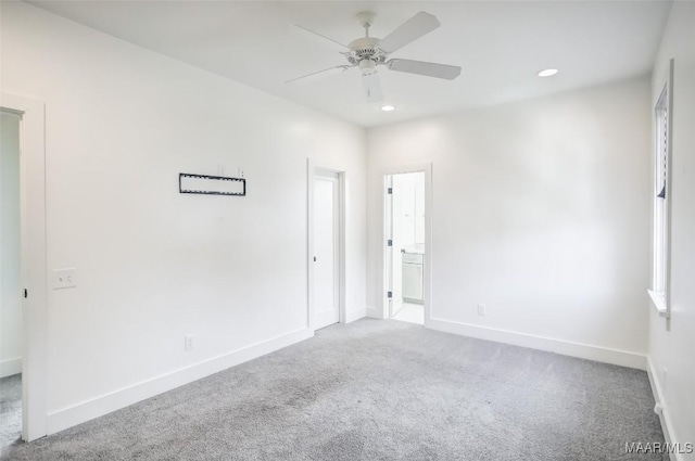 carpeted empty room featuring ceiling fan, recessed lighting, and baseboards