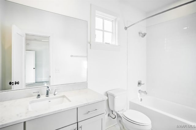 bathroom with bathtub / shower combination, vanity, and toilet