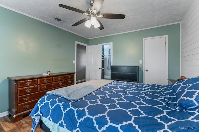 bedroom with dark hardwood / wood-style flooring, ceiling fan, ornamental molding, and a textured ceiling