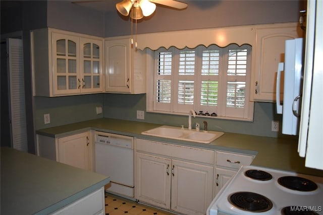 kitchen featuring white cabinetry, sink, white appliances, and ceiling fan