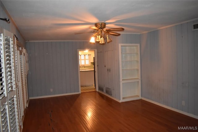 spare room with ornamental molding, hardwood / wood-style floors, and ceiling fan