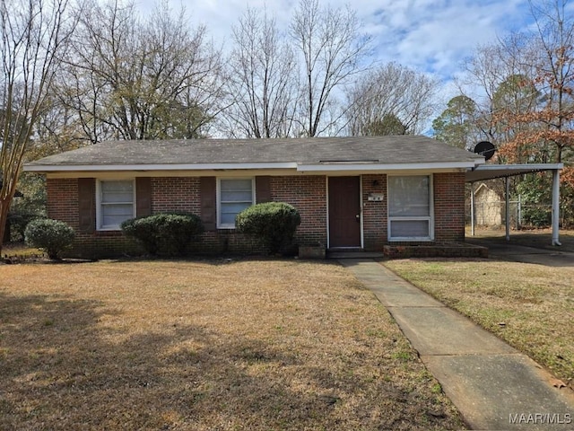 view of front of property with a carport and a front yard