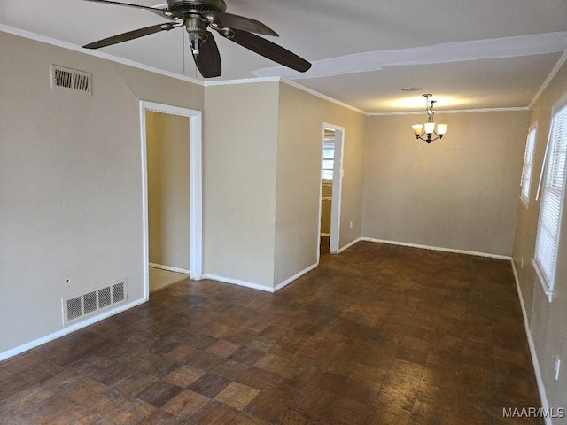 spare room featuring ornamental molding, ceiling fan with notable chandelier, and a wealth of natural light