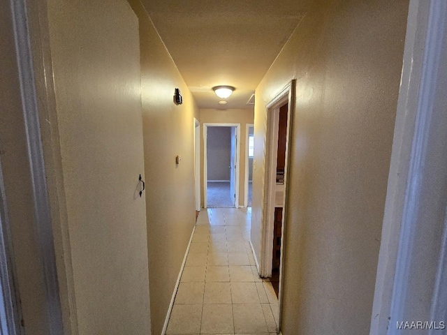 hallway featuring light tile patterned floors