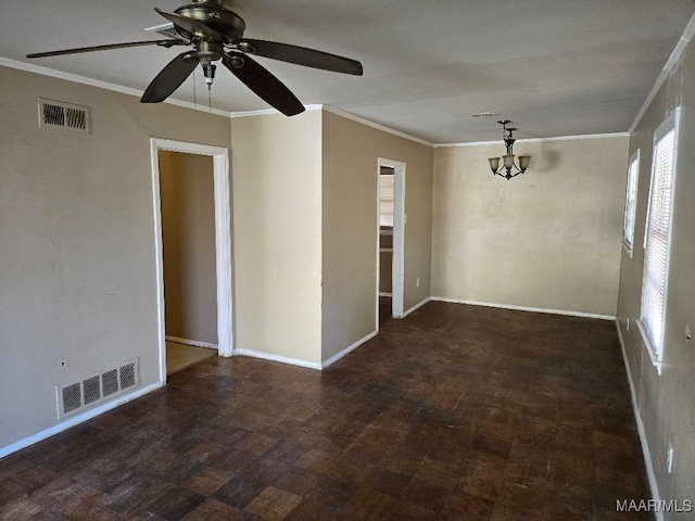 empty room with baseboards, visible vents, and ornamental molding