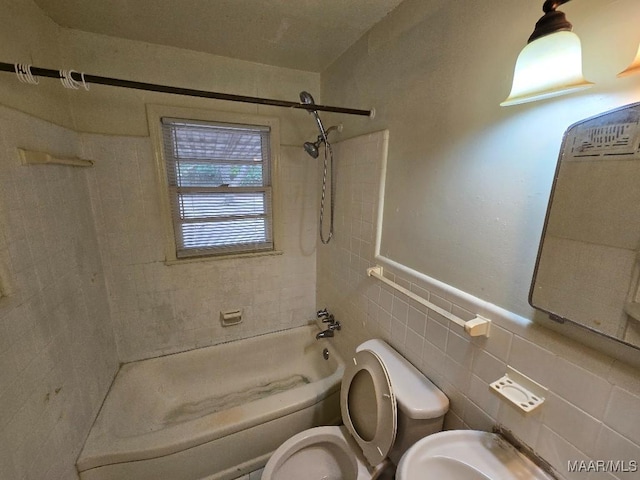 bathroom with toilet, shower / tub combination, and tile walls