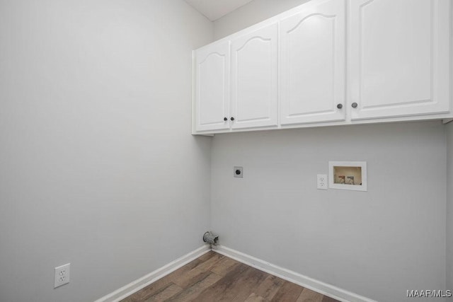 clothes washing area featuring dark wood-type flooring, cabinets, hookup for a washing machine, and electric dryer hookup