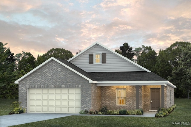 view of front of property featuring a garage and a yard