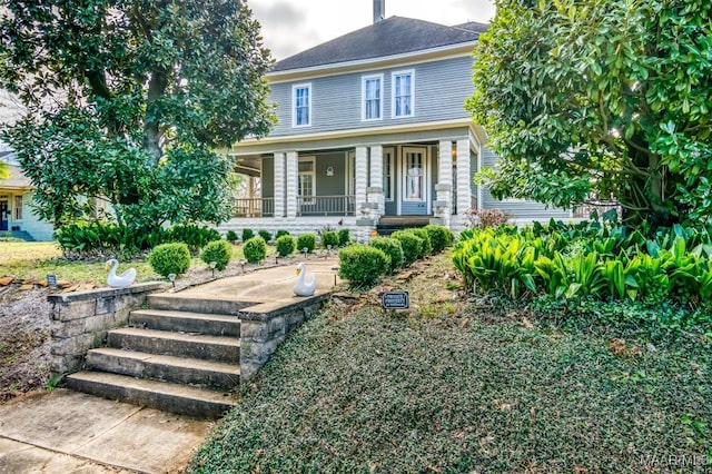 view of front of property featuring covered porch