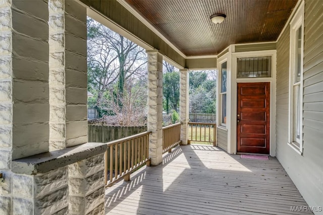 wooden terrace with a porch