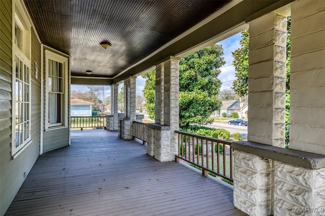 wooden deck featuring covered porch