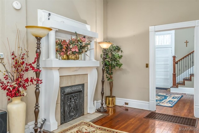 living room with a fireplace and light hardwood / wood-style floors