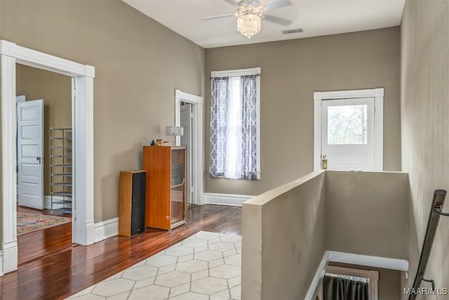 entryway with ceiling fan and hardwood / wood-style floors