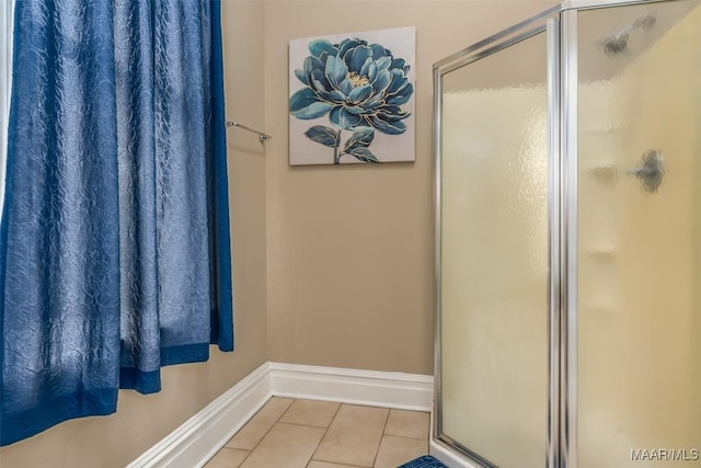 bathroom featuring tile patterned flooring and walk in shower