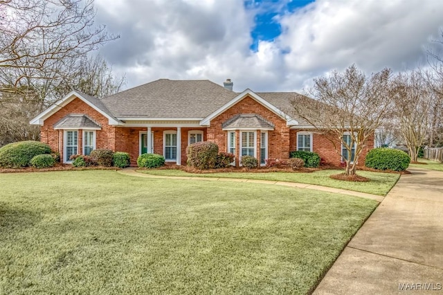 ranch-style house featuring a front yard