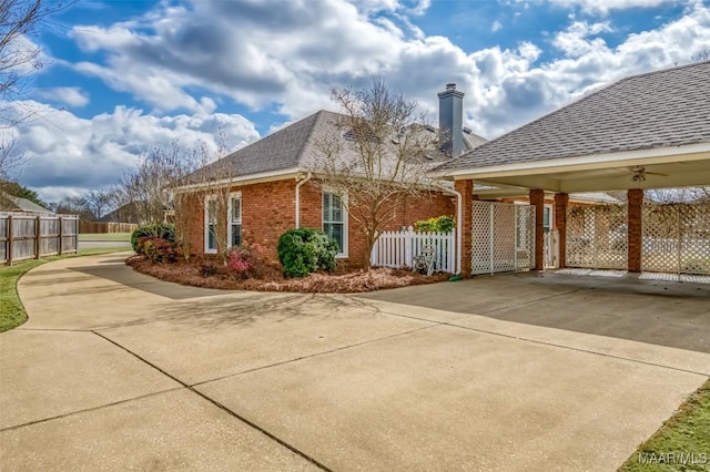 view of side of property with a carport