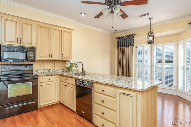 kitchen featuring sink, ornamental molding, kitchen peninsula, pendant lighting, and black appliances