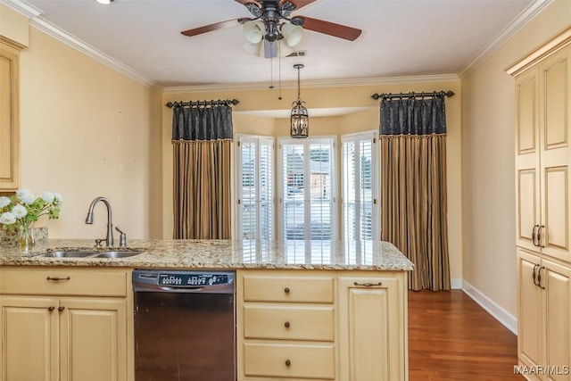 kitchen with light stone counters, cream cabinets, black dishwasher, and sink