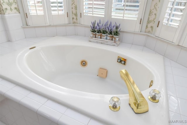 bathroom featuring a relaxing tiled tub