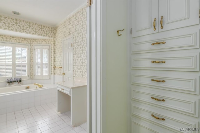 bathroom featuring tile patterned flooring, ornamental molding, and tiled bath