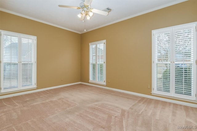 unfurnished room featuring crown molding, light carpet, and ceiling fan