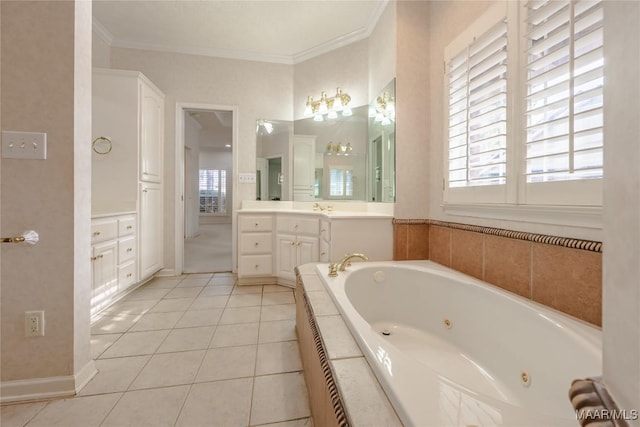 bathroom with crown molding, vanity, tile patterned flooring, and tiled tub