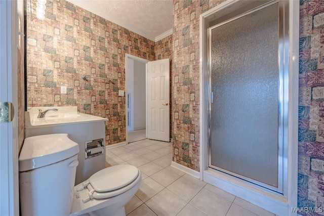 bathroom with sink, toilet, a shower with door, tile patterned floors, and a textured ceiling