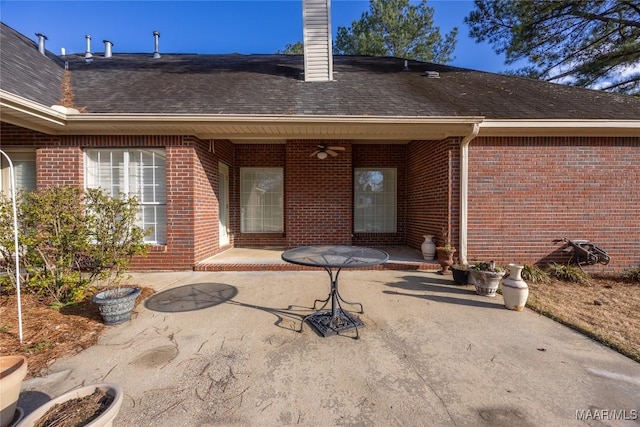 back of property with a patio