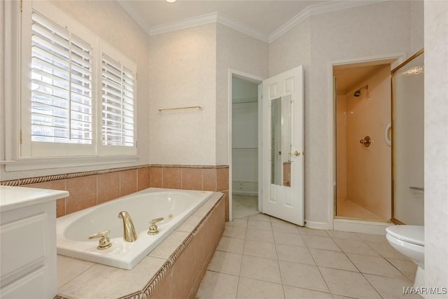 full bathroom featuring independent shower and bath, vanity, toilet, crown molding, and tile patterned floors