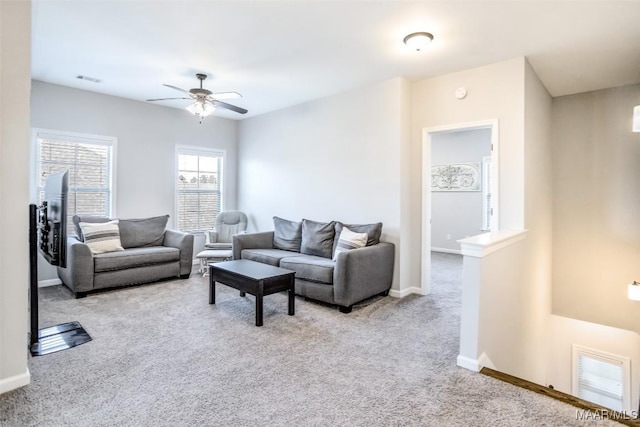 living room featuring light carpet and ceiling fan