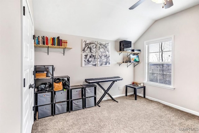 interior space with lofted ceiling, carpet flooring, and ceiling fan