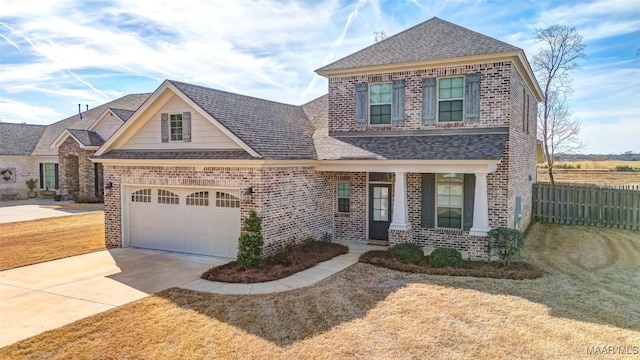 view of front facade with a garage and a front lawn