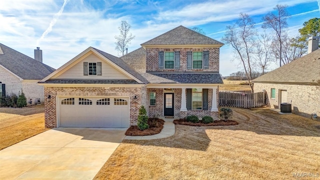 view of front of house featuring a garage, central AC, a front lawn, and a porch