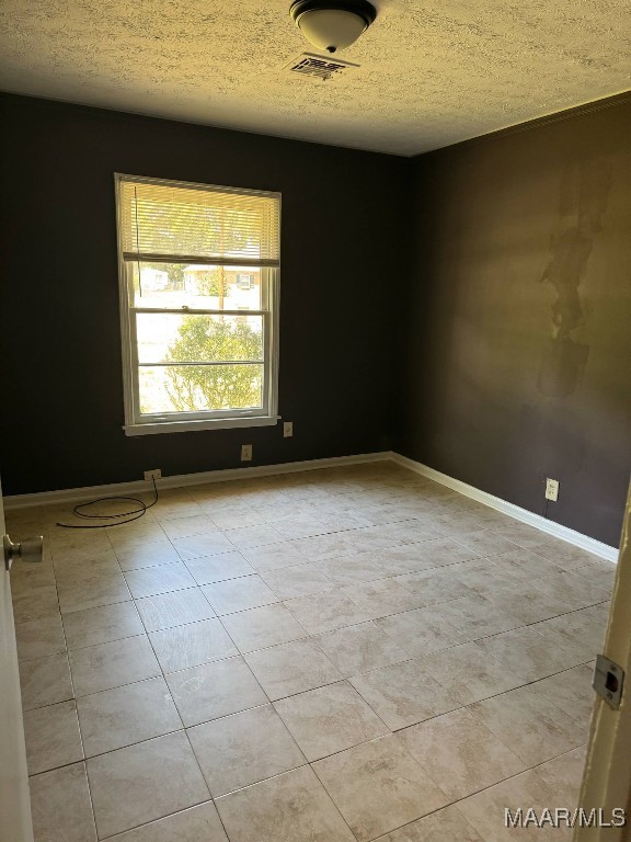 2716 Baldwin Brook Dr, Montgomery, AL 36116 - empty room with a textured ceiling