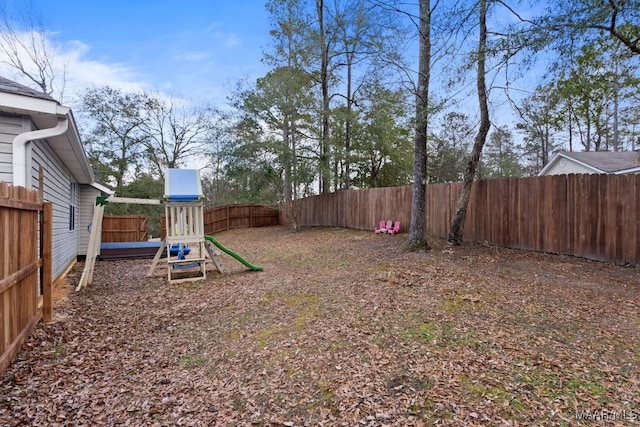 view of yard with a playground