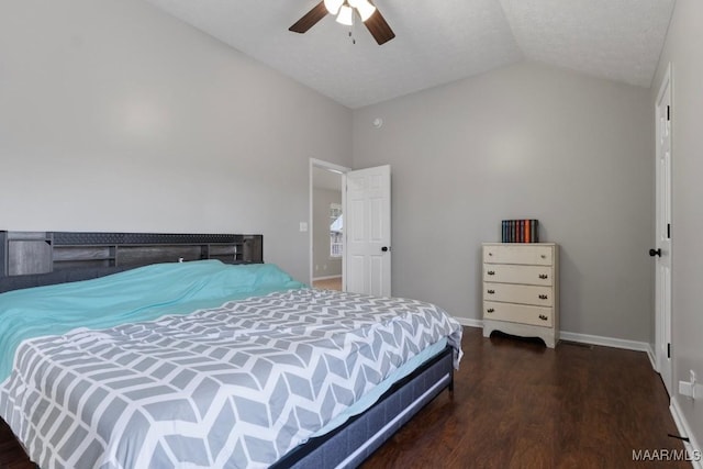 bedroom with dark hardwood / wood-style flooring, a textured ceiling, vaulted ceiling, and ceiling fan