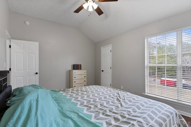 bedroom with ceiling fan and lofted ceiling