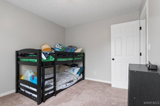 carpeted bedroom with a textured ceiling