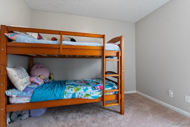 carpeted bedroom with a textured ceiling